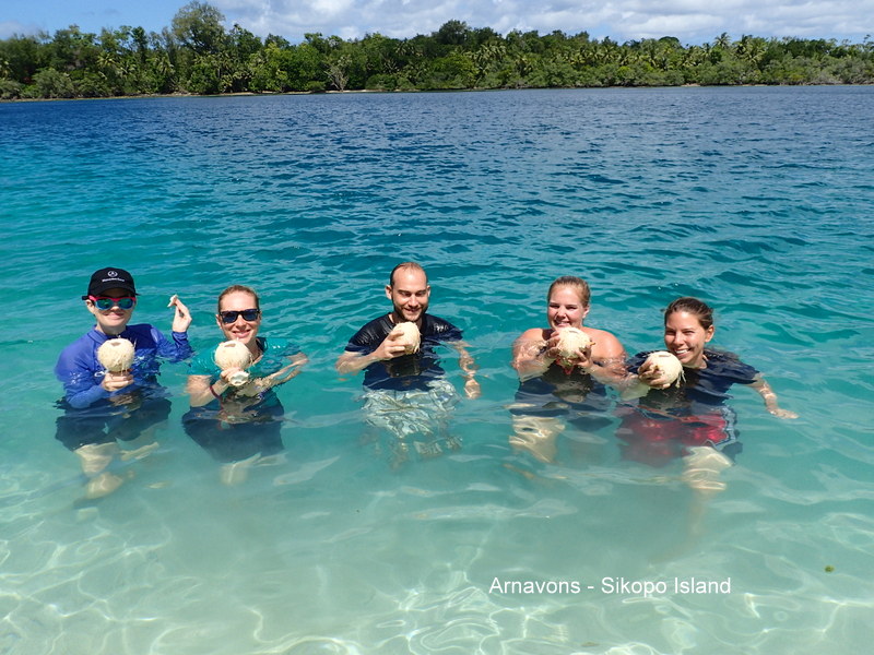 Ex-pat Guests enjoy coconut water in the tepid sea